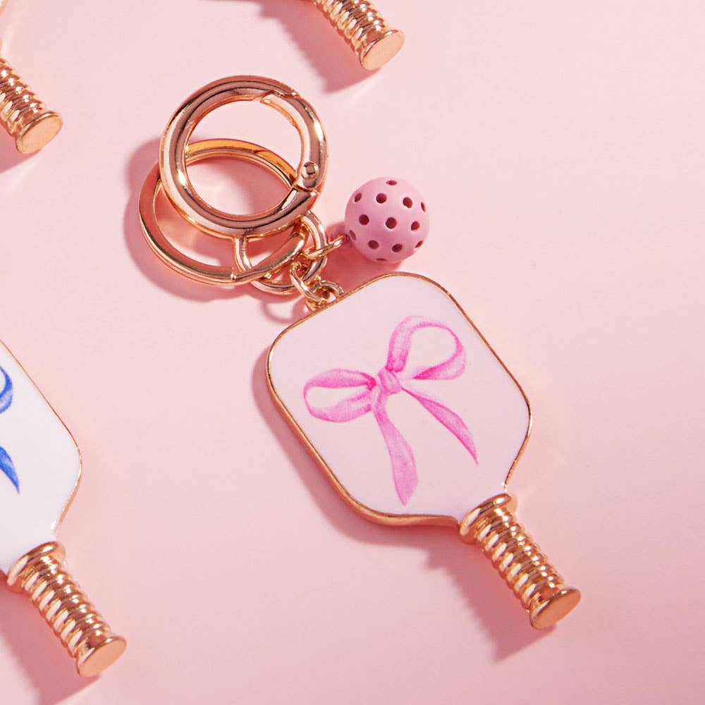 Enamel Pickleball Paddle Keychain β Blue and Pink Bow Design | Sensibling Corp. Charm