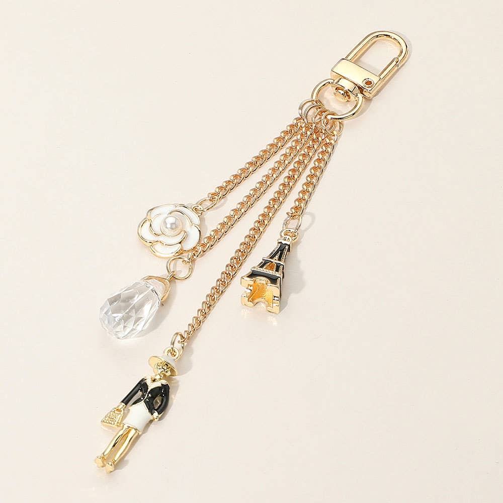 Enamel Eiffel Tower Lady Charm Keychain β Gold Bag Accessory with Flower Detail | Sensibling Corp.