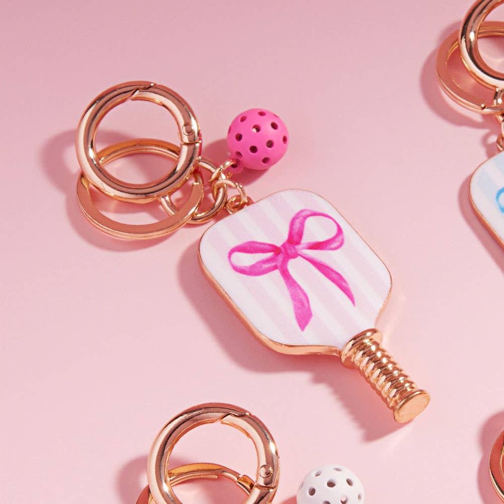 Enamel Pickleball Paddle Keychain β Blue and Pink Bow Design | Sensibling Corp. Charm