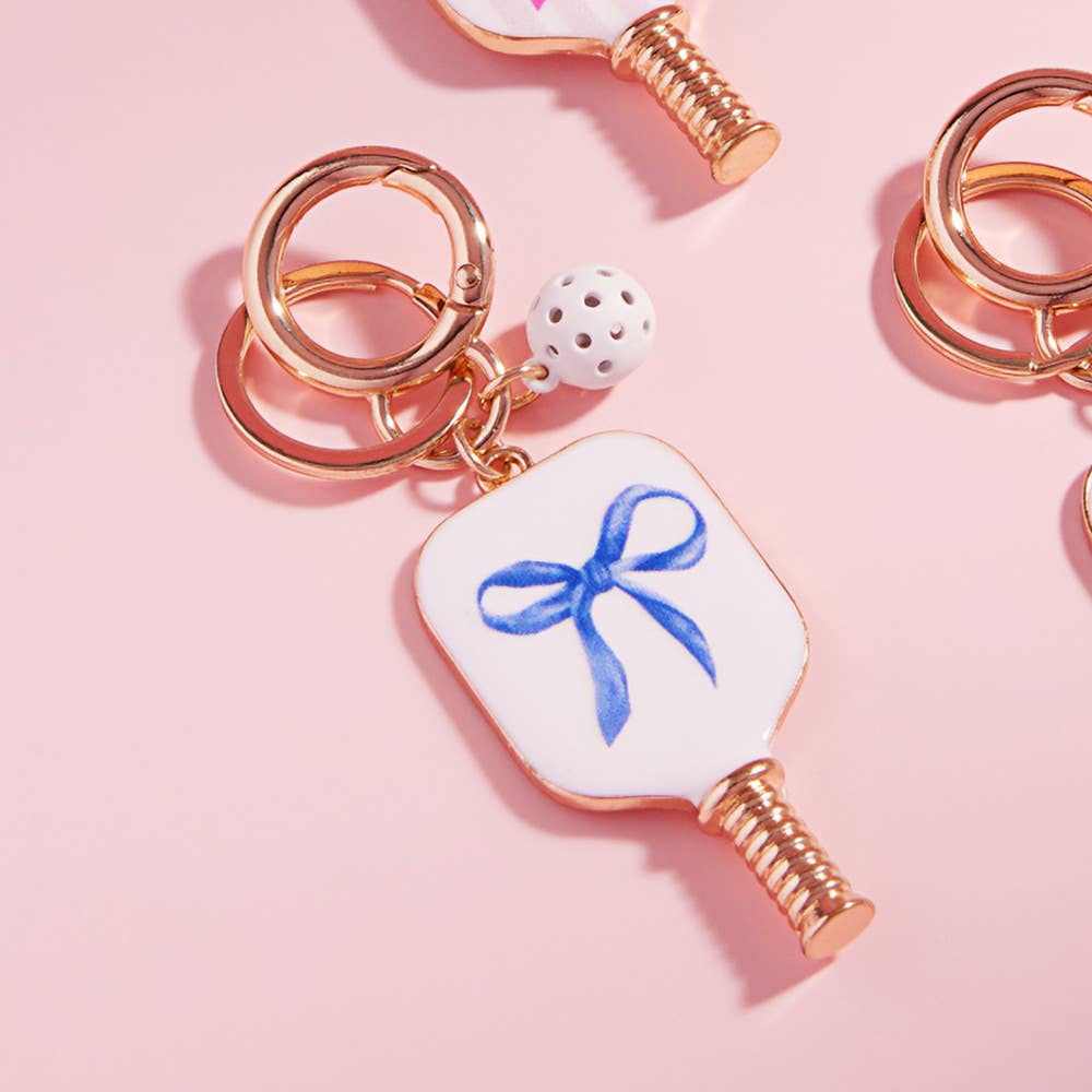Enamel Pickleball Paddle Keychain β Blue and Pink Bow Design | Sensibling Corp. Charm