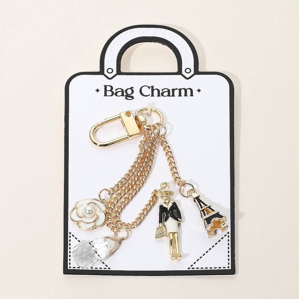 Enamel Eiffel Tower Lady Charm Keychain β Gold Bag Accessory with Flower Detail | Sensibling Corp.